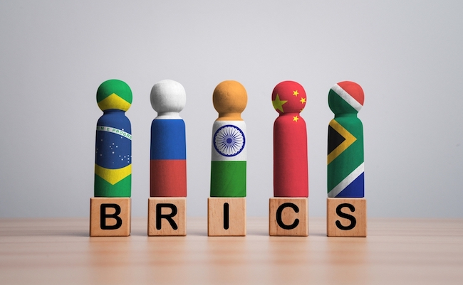 Brazil Russia India China and South Africa flag print screen on wooden figure for BRICS economic international cooperation concept.