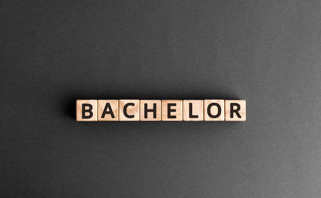 Bachelor - word from wooden blocks with letters, Bachelor men or  education concept,  top view on grey background