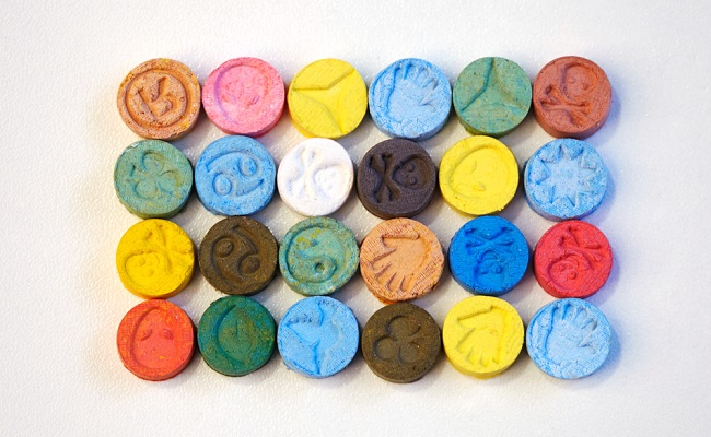 Several,Pills,Of,Mdma,(extasy),On,White,Table,Distributed,By