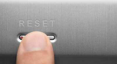 The,Reset,Button,On,The,Aluminum,Panel.,Male,Finger