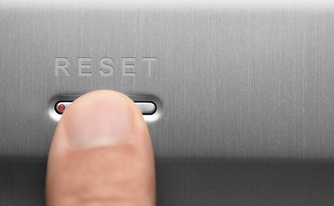 The,Reset,Button,On,The,Aluminum,Panel.,Male,Finger