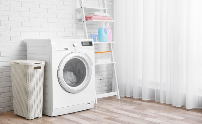 Modern,Washing,Machine,Near,Brick,Wall,In,Laundry,Room,Interior,
