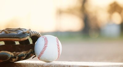 Copy,Space,On,Blurred,Background,By,Baseball,With,Glove,,Laying