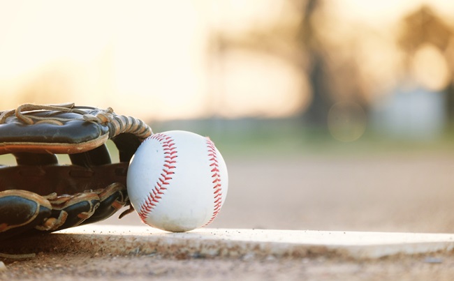 Copy,Space,On,Blurred,Background,By,Baseball,With,Glove,,Laying