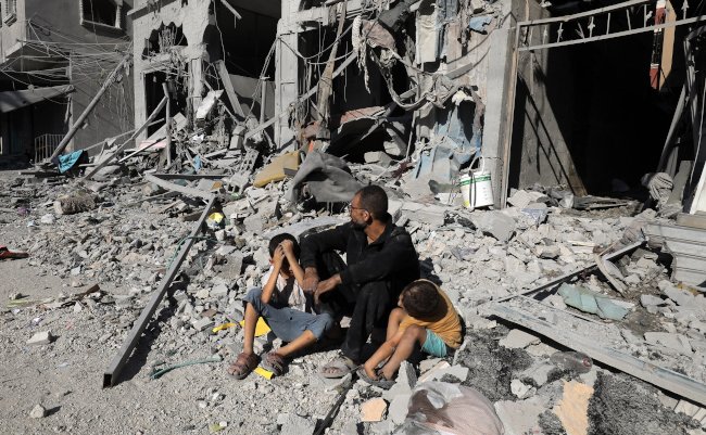 Palestinians,Search,A,House,After,An,Israeli,Air,Strike,,In