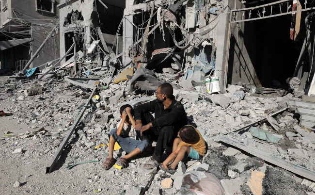 Palestinians,Search,A,House,After,An,Israeli,Air,Strike,,In