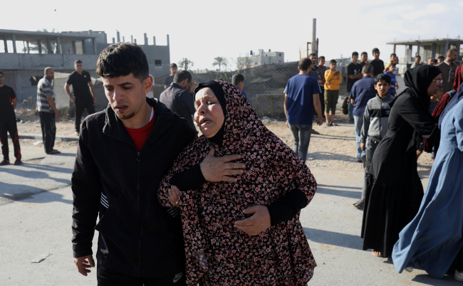 Palestinians,Recover,Bodies,From,Under,The,Rubble,Of,The,Home