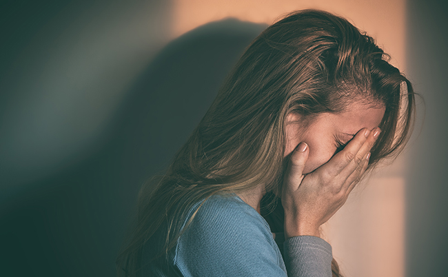 A,Woman,Sitting,Alone,And,Depressed
