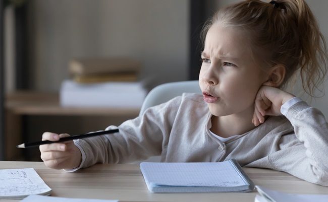 Unhappy,Little,Caucasian,Girl,Kid,Sit,At,Desk,Feel,Lazy