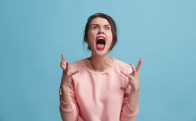 Screaming,,Hate,,Rage.,Crying,Emotional,Angry,Woman,Screaming,On,Blue