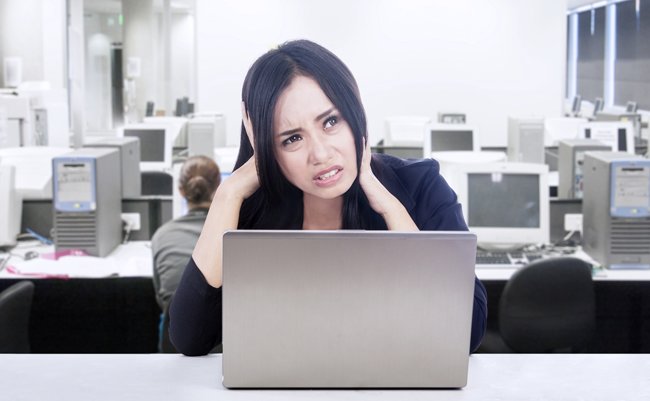Businesswoman having difficult computer project while working in her office