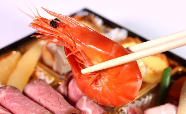 Eating,Japanese,New,Year,Dishes,Osechi,With,Chopsticks