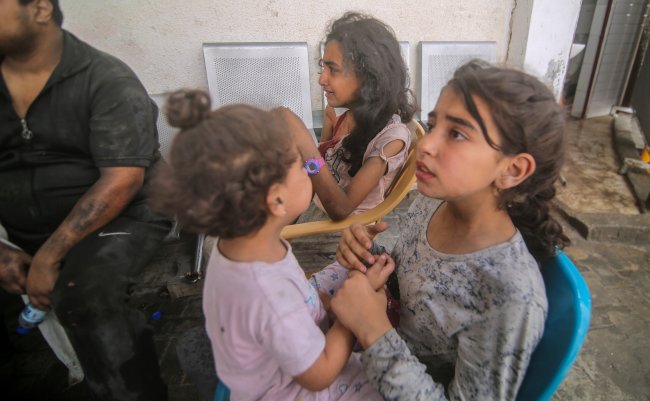 Palestinians,Evacuate,Wounded,After,An,Israeli,Airstrike,In,Rafah,Refugee