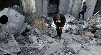 Palestinians,Search,A,House,After,An,Israeli,Air,Strike,,In