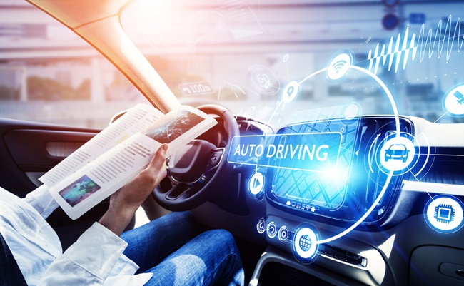 Young,Woman,Reading,A,Magazine,In,A,Autonomous,Car.,Driverless