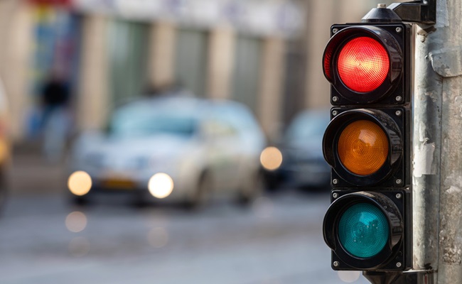 Blurred,View,Of,City,Traffic,With,Traffic,Lights,,In,The