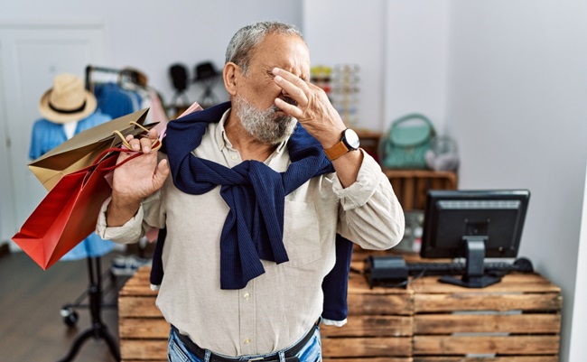 Handsome,Senior,Man,Holding,Shopping,Bags,At,Boutique,Shop,Smelling