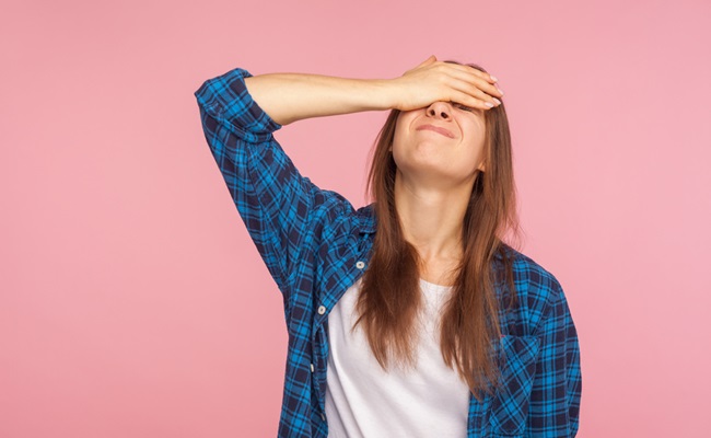Portrait,Of,Unlucky,Girl,In,Checkered,Shirt,Standing,With,Facepalm