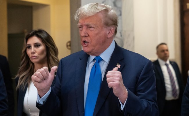 Former,President,Donald,Trump,Speaks,To,Press,Before,The,Start