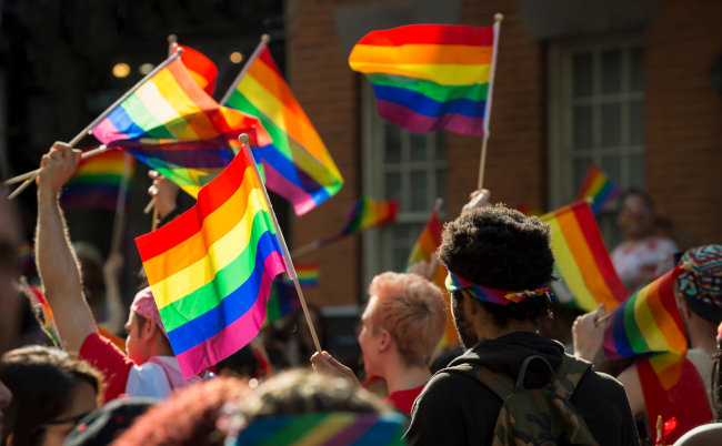 Supporters,Wave,Rainbow,Flags,And,Signs,At,The,Annual,Pride