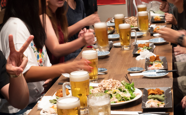 Blur,Image,Of,People,With,Glass,Of,Beer,At,The