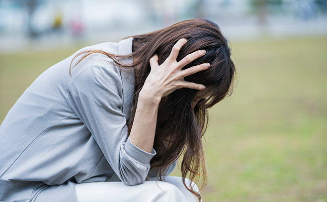 Business,Woman,Holding,Head,Due,To,Stress