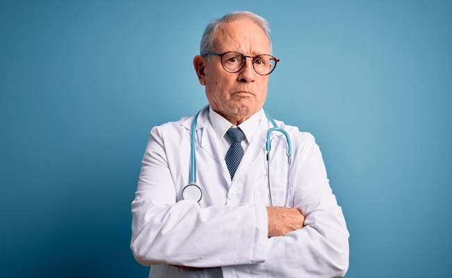 Senior,Grey,Haired,Doctor,Man,Wearing,Stethoscope,And,Medical,Coat