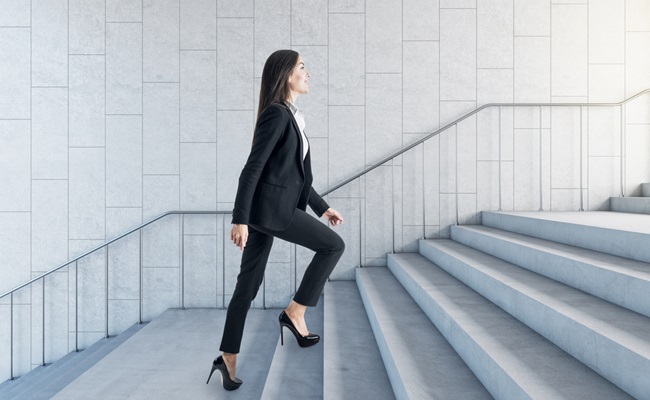 Road,To,Success,Concept,With,Businesswoman,Climbing,The,Stairs,In