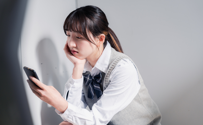 A,High,School,Girl,Who,Is,Depressed,While,Looking,At