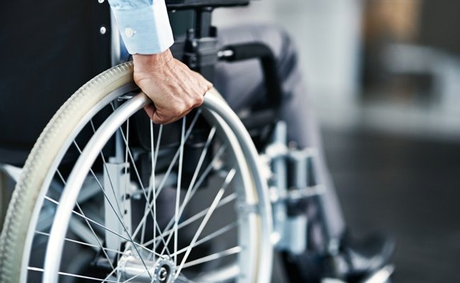 Wheelchair,,Disability,And,Man,Hand,Holding,Wheel,In,A,Hospital