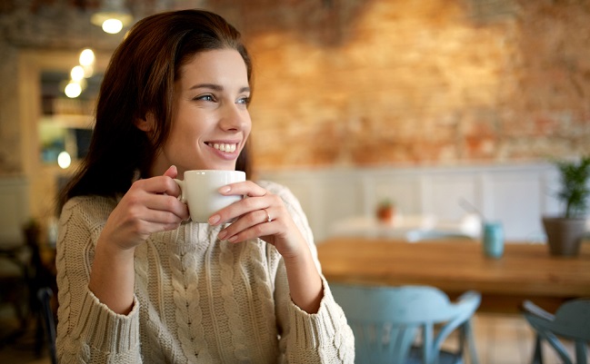 Woman,In,A,Cafe,Drinking,Coffee