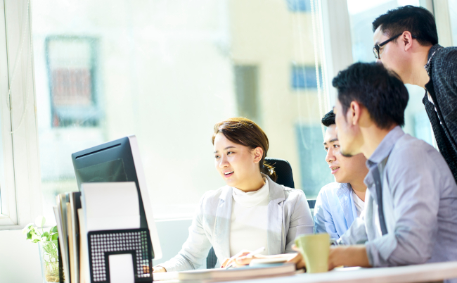 Four,Young,Asian,Businesspeople,Meeting,In,Office,Discussing,Business,Plan