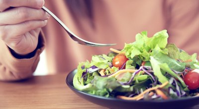 Closeup,Woman,Eating,Healthy,Food,Salad,,Focus,On,Salad,And