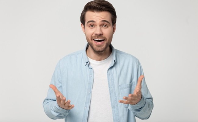 Shocked,Young,Man,In,Blue,Casual,Shirt,Isolated,On,Grey