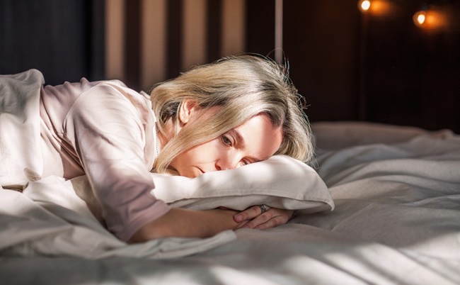 Tired,Middle,Aged,Woman,Lying,In,Bed,Can’t,Sleep,Late