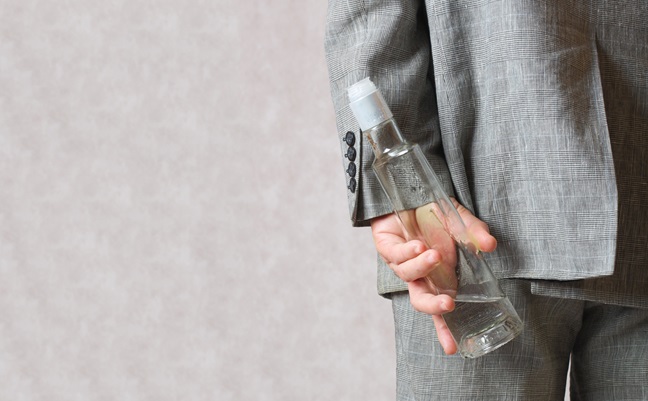 A,Man,Dressed,In,A,Classical,Costume,Hides,A,Bottle