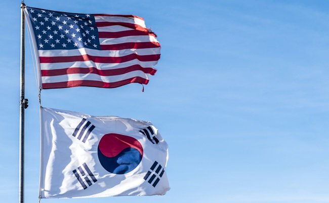 American,Flag,And,South,Korea,Flag,In,Blue,Sky,Background