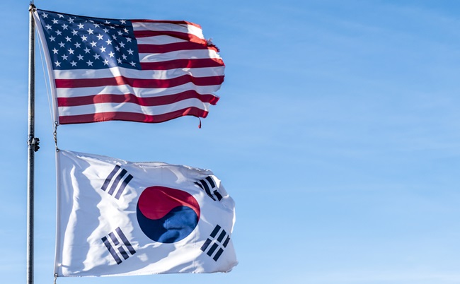American,Flag,And,South,Korea,Flag,In,Blue,Sky,Background