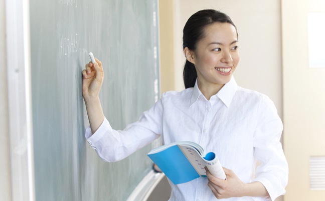 Female,Teachers,To,Write,A,Problem,On,The,Blackboard