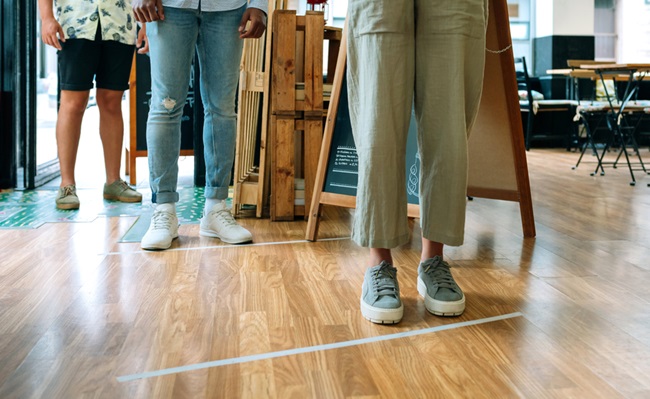 Unrecognizable,People,Queuing,Up,Keeping,Social,Distance,To,Enter,A