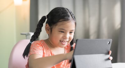 Asian,Child,Smile,Learning,With,Touch,Screen,On,Computer,Tablet