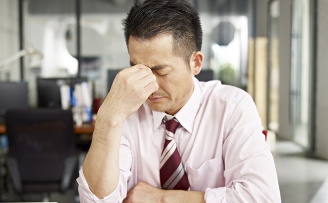 Asian,Businessman,Looking,Tired,And,Frustrated,In,Office.