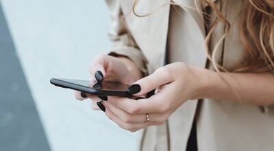 Young,Pretty,Woman,Posing,In,The,Street,With,Phone,,Outdoor