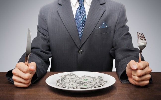 Greedy,Businessman,Eating,Banknotes,Symbolising,Consumerism.