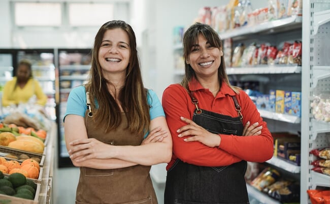 Mature women working together inside organic fresh minimarket