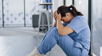 Healthcare,,Stress,And,Sad,Nurse,On,Floor,With,Burnout,,Anxiety