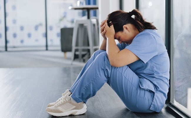 Healthcare,,Stress,And,Sad,Nurse,On,Floor,With,Burnout,,Anxiety