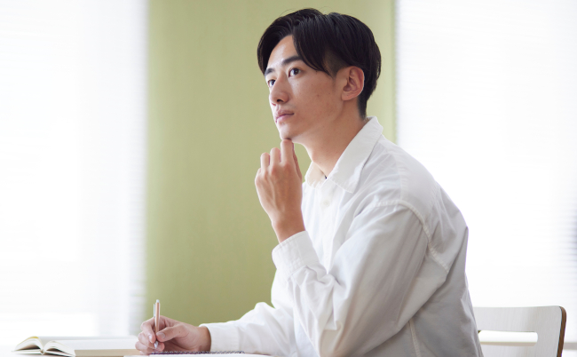 Japanese,Male,University,Student,Studying,In,The,University,Library