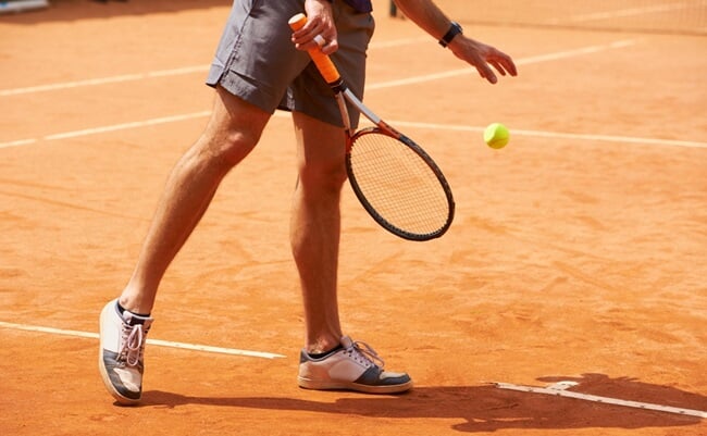 Tennis,,Court,And,Legs,Of,Person,Outdoor,At,Start,Of