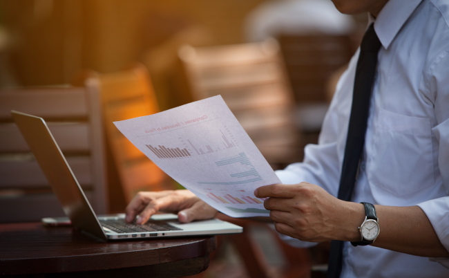 Businessman,Research,Study,And,Auditing,Income,Statement,Data,From,Excel